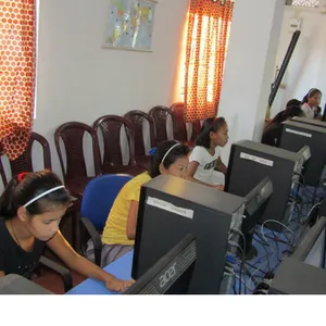 A girl learning on a computer in a skills class