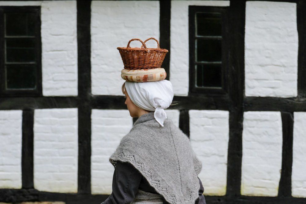 A woman carrying her family's load